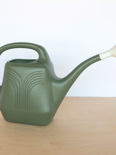 Green colored plastic watering can. 2 gallon capacity with removable spout