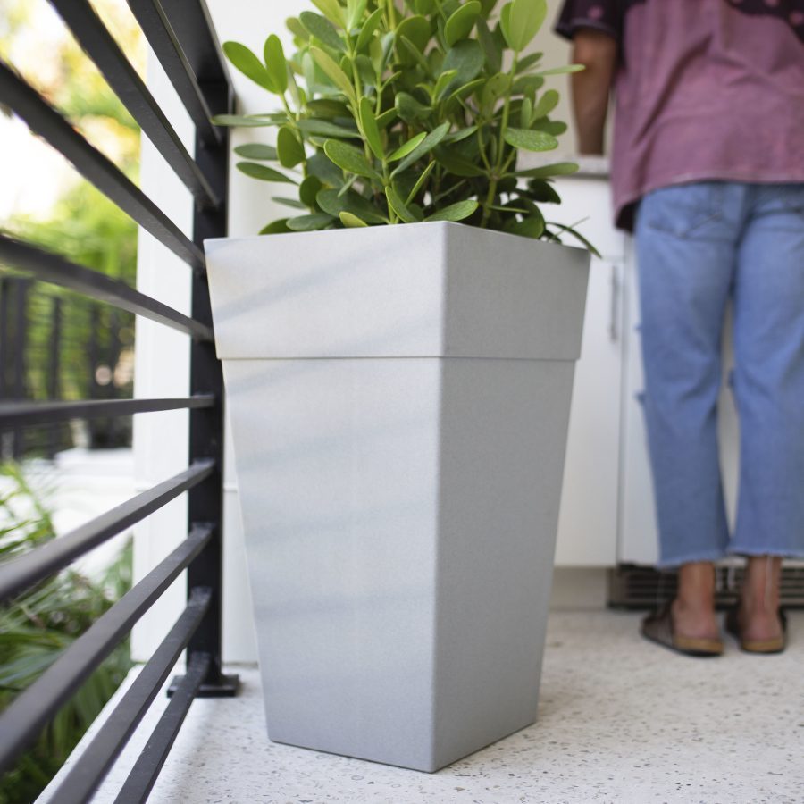 Tall square plastic planter that is lightweight and durable.