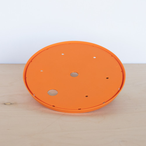 Soil saving insert. Circle disk fits inside a planter and reduces the amount of soil needed.